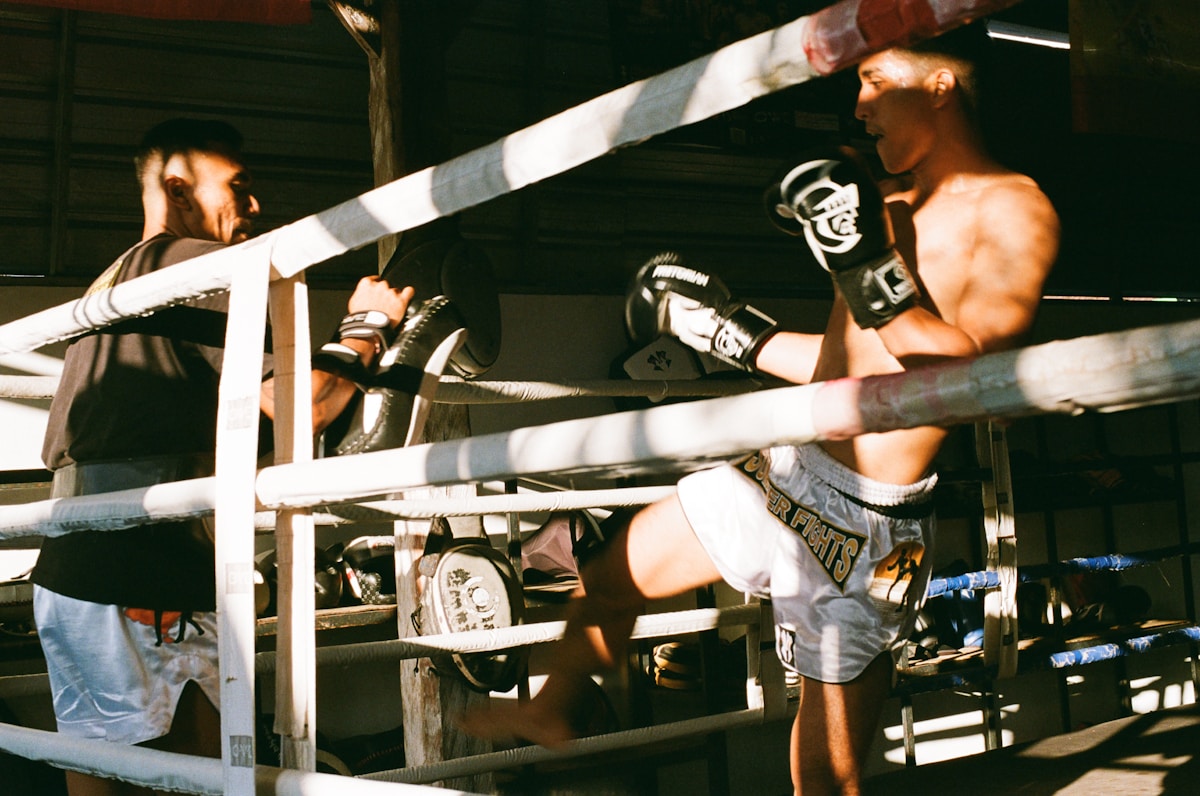 Martial arts training session in a boxing ring
