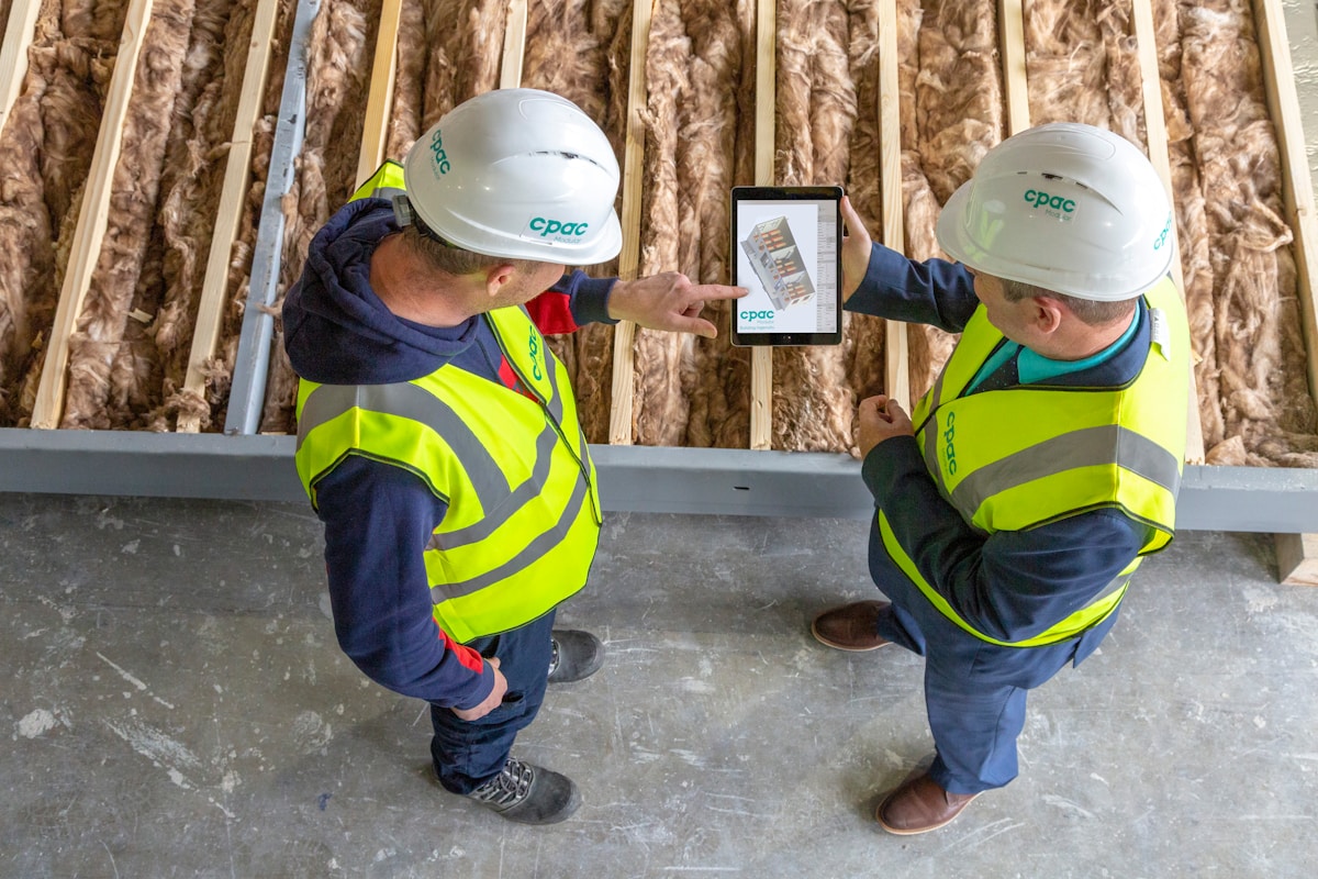 Workforce team reviewing plans on a tablet